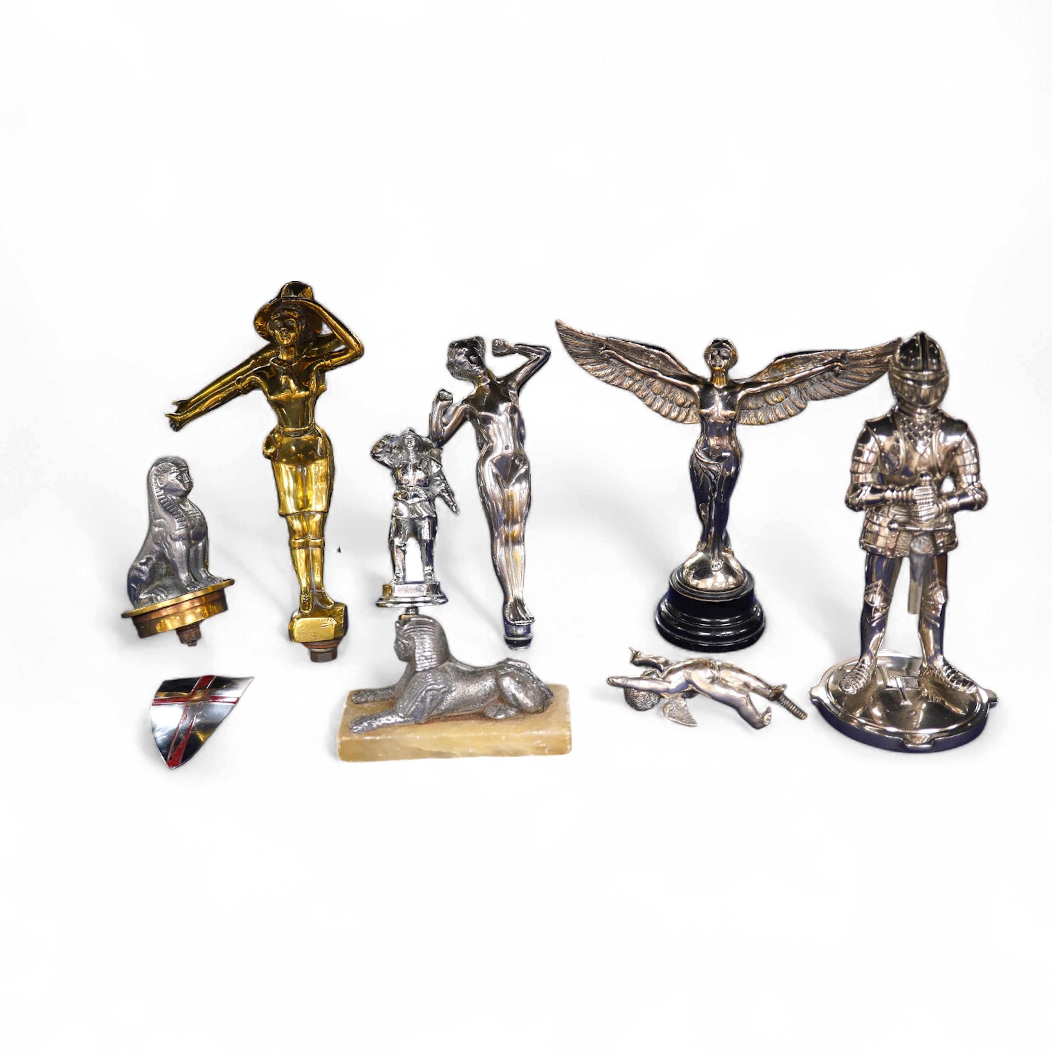 Eight figural chrome and brass car mascots, etc. including a knight in full armour mounted on a threaded radiator cap, a sphinx mounted on a threaded radiator cap, plus an additional sphinx mounted on an alabaster plinth